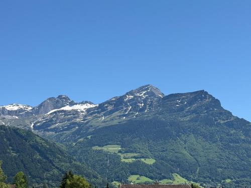 a view of a mountain range with snow capped mountains at SimpleSparks I Luzern I Andermatt I Natur I Family in Altdorf