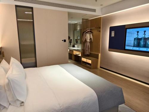 Katil atau katil-katil dalam bilik di Wanda Yue Hotel Tangshan North Station