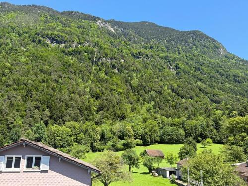 a house in front of a mountain at SimpleSparks I Luzern I Andermatt I Natur I Family in Altdorf