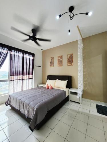 a bedroom with a bed and a ceiling fan at Malacca 3 bedroom Seri Serindit 07 in Malacca