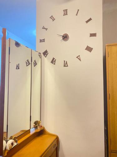 a clock on the side of a wall at Mesatierra, Davao - Condo for Rent in Davao City