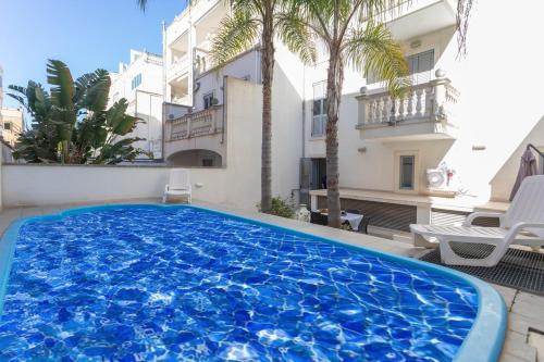 Swimmingpoolen hos eller tæt på Bilocale Corso Italia 694 con piscina - Salento Reservation