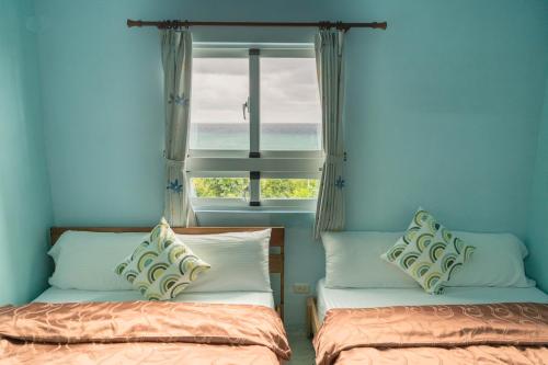 Postel nebo postele na pokoji v ubytování Moonlight