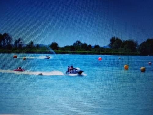 a group of people on a jet ski in the water at Aux 3 épis in Dienville