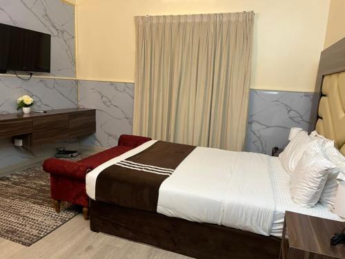 Ένα ή περισσότερα κρεβάτια σε δωμάτιο στο Holiday Homes