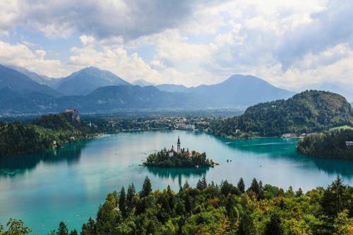 an island in the middle of a lake at Bohinj Eco Hotel in Bohinj