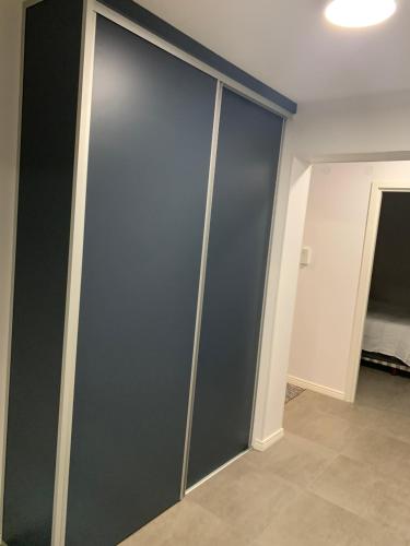 a sliding glass door in a room at Mysig lägenhet Malmö Centralt in Malmö