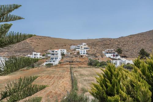 a group of white houses on top of a hill at Mouria House in Kithnos