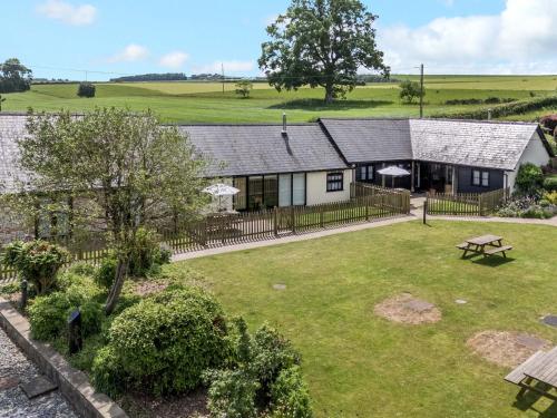 an aerial view of a house with a yard at The Old Stables in Blandford Forum