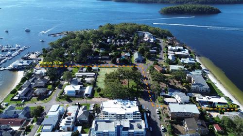 an aerial view of a small town next to the water at Soldiers Point Escape in Soldiers Point