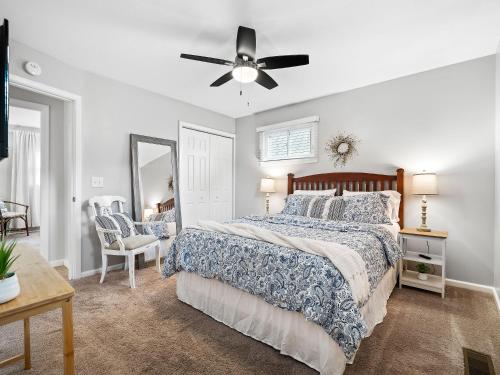 a bedroom with a bed and a ceiling fan at Beachwood Ave, Avon Lake in Avon Lake