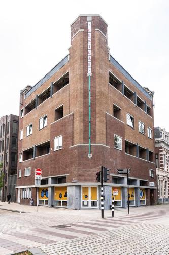 a large brick building on a city street at City Center Stay Fast Wi-fi, Designer Bathroom in Tilburg