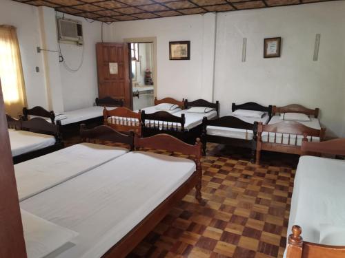 a room with a bunch of beds in it at Verandas Beach Resort in Carmen
