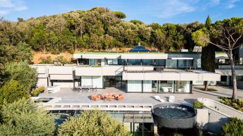 an aerial view of a house with a pool at Extreme Luxury Villa in Punta Ala with Private Pool, SPA and Gym in Punta Ala