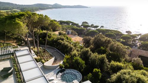 a view of the ocean from a house at Extreme Luxury Villa in Punta Ala with Private Pool, SPA and Gym in Punta Ala