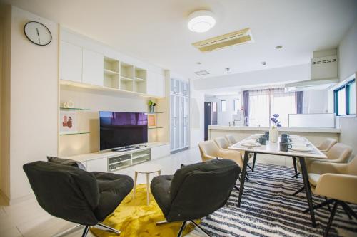 a kitchen and dining room with a table and chairs at R Residence 谷町 in Osaka