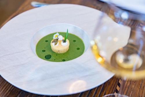 a dessert on a white plate on a table at Der Schlosswirt zu Anif - Biedermeierhotel und Restaurant in Anif