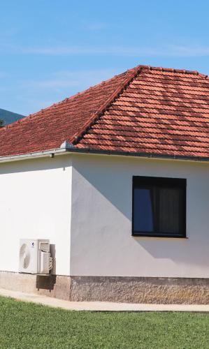 a white house with a red roof at Casa L in Ulcinj