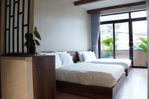 Katil atau katil-katil dalam bilik di Thom Homestay