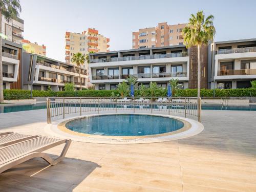 a swimming pool in the middle of a building at Glory Life in Antalya