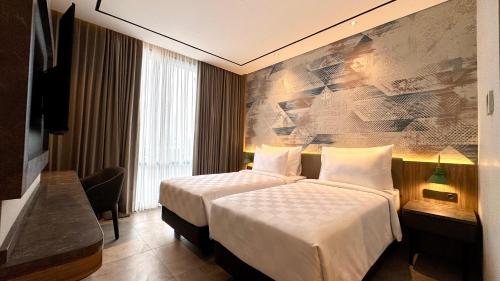 Letto o letti in una camera di Azana Boutique Bandar Lampung