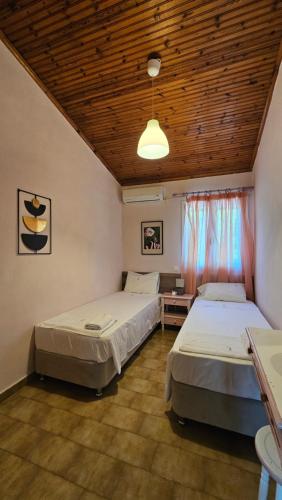 Postel nebo postele na pokoji v ubytování Errika