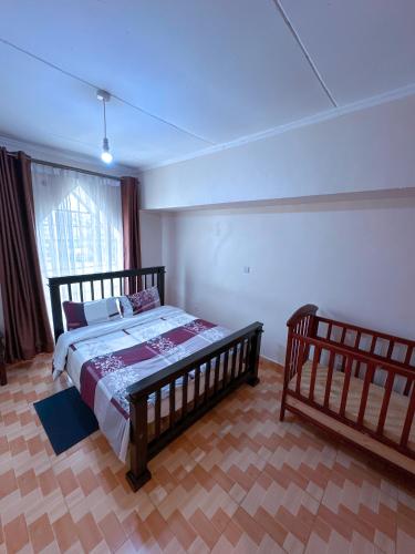 a bedroom with a wooden bed and a window at Lakeside Two Bedroom Penthouses in Goat Island