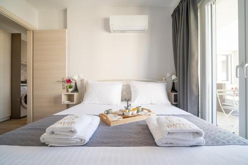Ένα ή περισσότερα κρεβάτια σε δωμάτιο στο David Luxury Experience E1