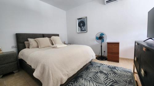 Ένα ή περισσότερα κρεβάτια σε δωμάτιο στο Ibiza Sunshine Hideaway