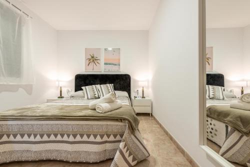 Ένα ή περισσότερα κρεβάτια σε δωμάτιο στο Bettatur Apartament Nanos