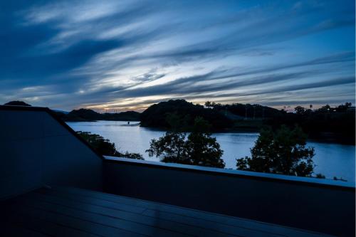 a view of a river at dusk from a balcony at Seaside Villa N - Vacation STAY 21981v in Mitsugoe