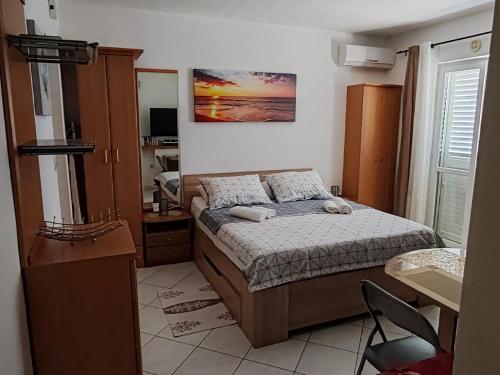 Postel nebo postele na pokoji v ubytování Studio Mali Raj