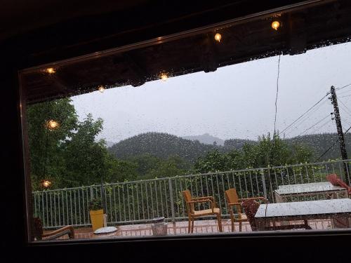 a view of a balcony with a table and chairs at Casa Rural Areano in Escoriaza