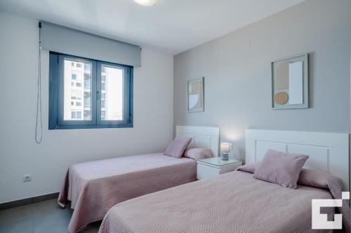 Postel nebo postele na pokoji v ubytování Apartamento Bernia al Mar 8B - Grupo Turis