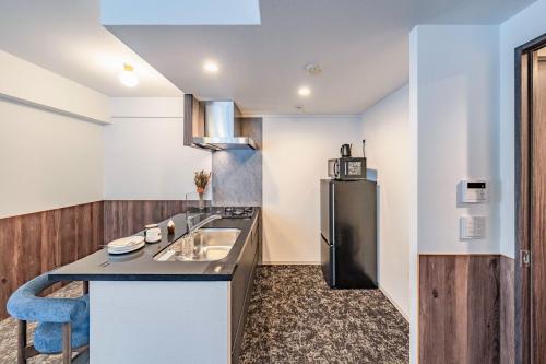 Η κουζίνα ή μικρή κουζίνα στο Apartment Hotel 11 Abeno