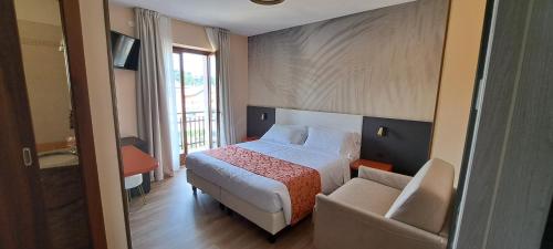 Postel nebo postele na pokoji v ubytování Hotel B&B Fortuna