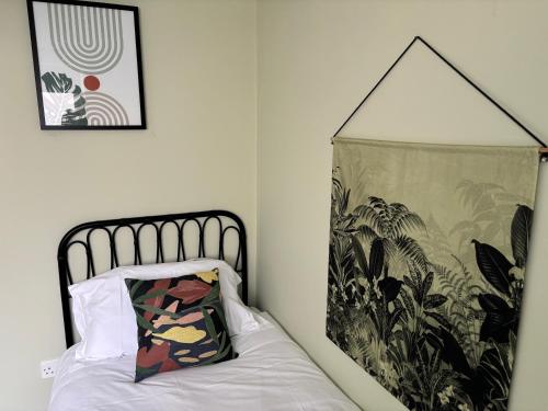 a bedroom with a bed and a blanket on the wall at 18 All Saints Passage in Huntingdon