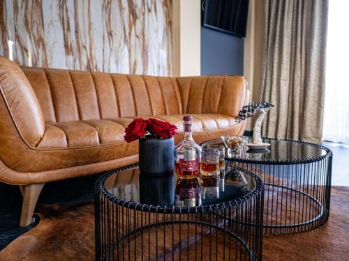 a living room with a couch and a table at SPA Hotel Olymp in Velingrad