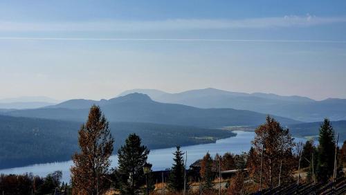 a view of a lake with mountains in the distance at Langleiken in Sør-Fron