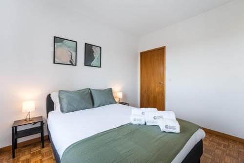 En eller flere senge i et værelse på GuestReady - Comfortable Gaia Escape