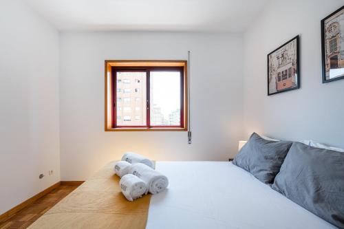 En eller flere senge i et værelse på GuestReady - Comfortable Gaia Escape