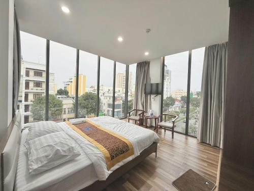 Postel nebo postele na pokoji v ubytování MBee Hotel