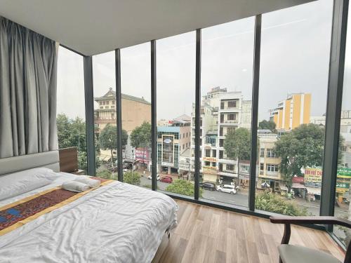 Postel nebo postele na pokoji v ubytování MBee Hotel