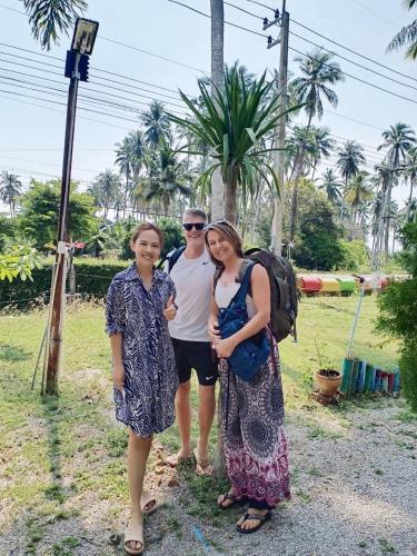 a group of three people posing for a picture at Wandee Resort Bankrut in Ban Krut