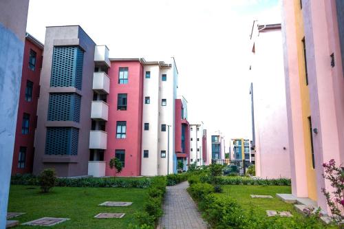 a row of tall buildings in a city at The Greige 3 Lakeside Condo in Entebbe in Entebbe