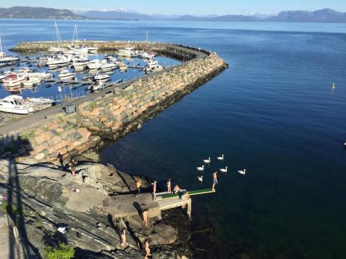 an aerial view of a marina with boats in the water at Apartment Suite in Os in Osøyro