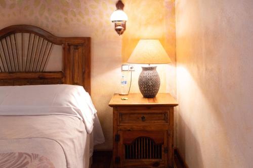 Ένα ή περισσότερα κρεβάτια σε δωμάτιο στο Hotel Rural Sucuevas