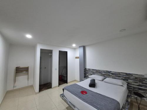 Katil atau katil-katil dalam bilik di Hotel Spa Laureles