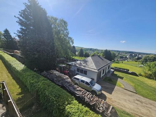 a car parked in front of a house at chalet saint Hubert in Saint-Hubert