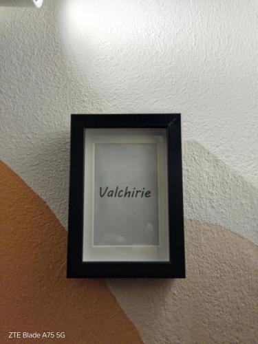 a black picture frame on a ceiling with the word valhalla at wagner 11 in Faenza